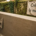 Crépi muret taloché sur muret en parpaings, finition sans fissures